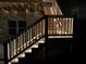 Well-lit staircase leading to the deck, adding a touch of elegance and safety to the outdoor space at 5533 Addison Woods Pl, Buford, GA 30518