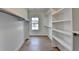 Spacious walk-in closet with custom shelving and ample storage space at 5533 Addison Woods Pl, Buford, GA 30518