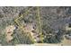 Aerial view of the property showcasing its spacious wooded acreage, including the home site at 5642 N Highway 212, Covington, GA 30016