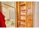 Bright bathroom featuring a bathtub with glass block window and built-in wooden shelves at 5642 N Highway 212, Covington, GA 30016