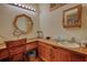 Bathroom with wooden vanity, decorative mirrors, and great lighting at 5642 N Highway 212, Covington, GA 30016