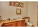 Rustic bathroom with wooden vanity, mirror, and ample counter space at 5642 N Highway 212, Covington, GA 30016