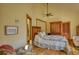 Bedroom with a light green quilt, ceiling fan, and unique glass-block window at 5642 N Highway 212, Covington, GA 30016