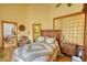 Bedroom with a light green quilt, ceiling fan, and unique glass-block window at 5642 N Highway 212, Covington, GA 30016