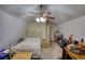 Comfortable bedroom featuring neutral walls, a ceiling fan, and closet space at 5642 N Highway 212, Covington, GA 30016