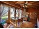 Bright dining room with wood floors, large windows, and a wooden table at 5642 N Highway 212, Covington, GA 30016