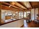 Open kitchen with wood floors, wooden beams, butcher block countertops, and an open floorplan at 5642 N Highway 212, Covington, GA 30016