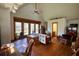 Bright living room with hardwood floors and large windows offering ample natural light and outdoor views at 5642 N Highway 212, Covington, GA 30016