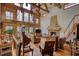 Spacious living room with high ceilings, wood floors, fireplace, and ample natural light at 5642 N Highway 212, Covington, GA 30016