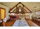 Charming space with a futon, desk, exposed wood beams, and ladder to a loft at 5642 N Highway 212, Covington, GA 30016