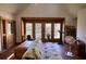 Bright room with wood floors, a futon, and large windows providing natural light and a view at 5642 N Highway 212, Covington, GA 30016