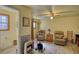 Inviting living room featuring laminate floors, comfortable seating, and a ceiling fan at 5642 N Highway 212, Covington, GA 30016