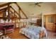Cozy space with wood floors, exposed beams, a futon, and a ladder to a loft at 5642 N Highway 212, Covington, GA 30016