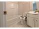 Bathroom featuring a single sink vanity and a shower-tub combo at 11780 Wellsley Way, Alpharetta, GA 30005