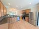 Modern kitchen featuring stainless steel appliances and granite countertops at 11780 Wellsley Way, Alpharetta, GA 30005
