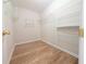 Spacious walk-in closet with custom shelving at 11780 Wellsley Way, Alpharetta, GA 30005