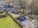 Aerial view of backyard featuring a pool, lush lawn, and parking area for three cars behind a wooden fence at 733 Cherokee Se Ave, Atlanta, GA 30315