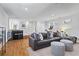 Spacious basement living area with hardwood floors, sofa, and a wet bar at 733 Cherokee Se Ave, Atlanta, GA 30315