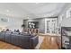Basement living room features a large sectional sofa and hardwood floors at 733 Cherokee Se Ave, Atlanta, GA 30315