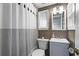 Cozy bathroom featuring a stylish vanity and a decorative shower curtain at 733 Cherokee Se Ave, Atlanta, GA 30315