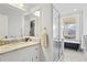 Bright bathroom features a clawfoot tub, glass enclosed shower, and marble countertop at 733 Cherokee Se Ave, Atlanta, GA 30315
