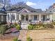 Charming home features a welcoming front porch, landscaped yard, and stone pathway to the front door at 733 Cherokee Se Ave, Atlanta, GA 30315