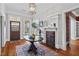 Stylish foyer with hardwood floors, ornate fireplace, and charming details, offering a grand entrance at 733 Cherokee Se Ave, Atlanta, GA 30315