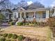 Charming home exterior with a welcoming porch, colorful landscaping, and a well-manicured front yard at 733 Cherokee Se Ave, Atlanta, GA 30315