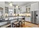 Bright kitchen featuring stainless steel appliances and a breakfast bar with seating at 733 Cherokee Se Ave, Atlanta, GA 30315