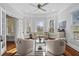 Bright living room features hardwood floors, large windows, and elegant furnishings for comfortable living at 733 Cherokee Se Ave, Atlanta, GA 30315