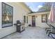 Outdoor patio with tile flooring, grill, outdoor furniture, and access to the home through a purple door at 733 Cherokee Se Ave, Atlanta, GA 30315