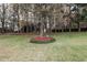 Expansive backyard featuring a mature tree, landscaping and a well-maintained lawn with an inviting outdoor space at 1850 Westwind Dr, Cumming, GA 30041