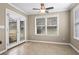 Breakfast nook with tile floors, ceiling fan, and access to the backyard at 1850 Westwind Dr, Cumming, GA 30041