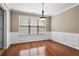 Traditional dining room featuring beautiful hardwood floors, crown molding and large window at 1850 Westwind Dr, Cumming, GA 30041