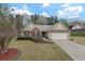 Charming one-story home featuring a brick facade, attached garage, and well-maintained landscaping at 1850 Westwind Dr, Cumming, GA 30041