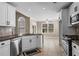 Modern kitchen featuring granite countertops, stainless steel appliances, and white cabinets at 1850 Westwind Dr, Cumming, GA 30041