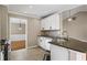 Kitchen with granite countertops, stainless steel appliances, and white cabinetry at 1850 Westwind Dr, Cumming, GA 30041
