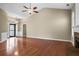 Open living area featuring hardwood floors, a ceiling fan, and ample space at 1850 Westwind Dr, Cumming, GA 30041