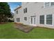 Well-maintained backyard with lush green grass and a patio area, perfect for entertaining at 4776 Trilogy Park Trl, Hoschton, GA 30548