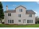 Two-story house with backyard featuring a well-maintained lawn and ample sunlight at 4776 Trilogy Park Trl, Hoschton, GA 30548