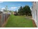Backyard featuring a large grassy area perfect for outdoor activities at 4776 Trilogy Park Trl, Hoschton, GA 30548