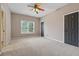 Bedroom with two entry doors and a window overlooking the backyard at 4776 Trilogy Park Trl, Hoschton, GA 30548