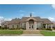 Community clubhouse with manicured landscaping and a welcoming entrance at 4776 Trilogy Park Trl, Hoschton, GA 30548