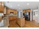 Charming kitchen boasts granite countertops, stainless steel appliances, and a functional island at 4776 Trilogy Park Trl, Hoschton, GA 30548