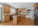 Well-appointed kitchen offering granite countertops, island seating, and seamless transition to the living room at 4776 Trilogy Park Trl, Hoschton, GA 30548