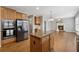 Spacious kitchen features an island, stainless appliances, and seamless transition to a living area at 4776 Trilogy Park Trl, Hoschton, GA 30548