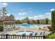 Relax in the community pool, complete with lounge chairs and splash umbrella at 4776 Trilogy Park Trl, Hoschton, GA 30548