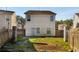 The backyard is fenced in with a small concrete patio and grass growing at 6439 Grey Fox Way, Riverdale, GA 30296