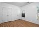 Bright bedroom with wood floors, two closets, and windows providing natural light at 6439 Grey Fox Way, Riverdale, GA 30296