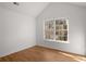 Bedroom with vaulted ceiling, hardwood floors and a window offering outdoor views at 6439 Grey Fox Way, Riverdale, GA 30296